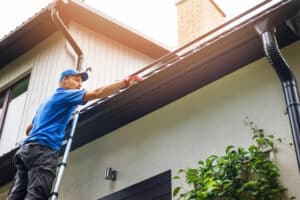 Man cleaning roof