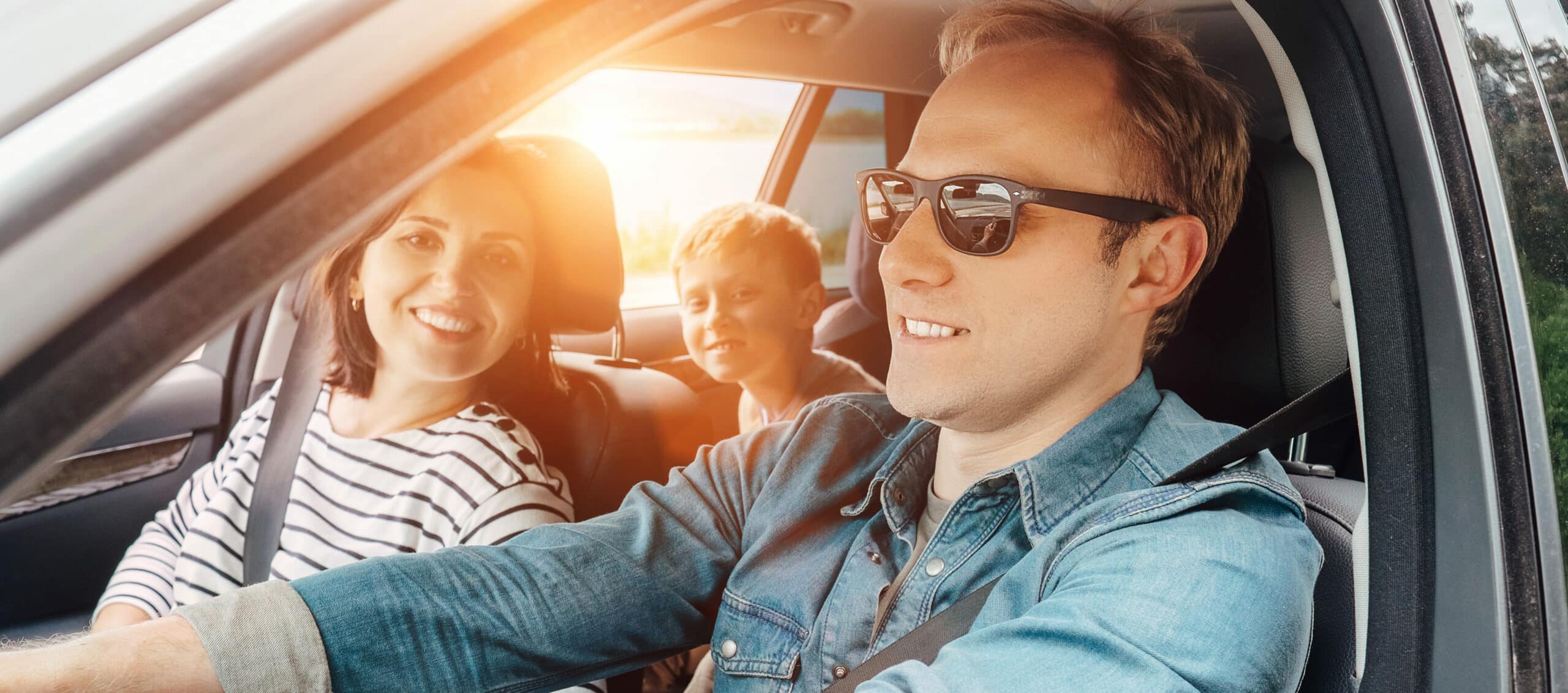 Family in Car - shutterstock_434444011