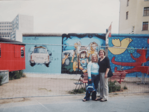 Caitlin in front of the Berlin Wall