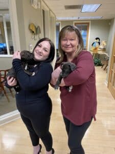 Caitlin and Dova with puppies